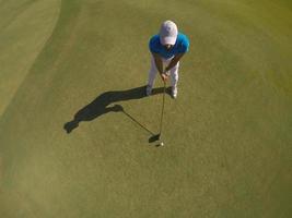 top view of golf player hitting shot photo