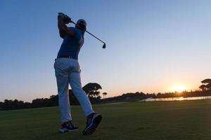 golfer hitting long shot photo