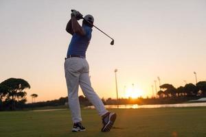 golfer hitting long shot photo