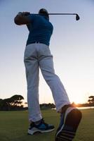 golfer hitting long shot photo