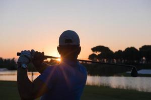 golfer hitting long shot photo