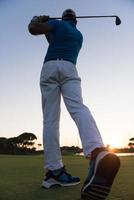 golfer hitting long shot photo