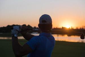 golfer hitting long shot photo