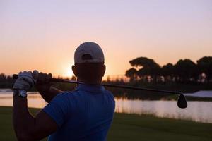 golfer hitting long shot photo