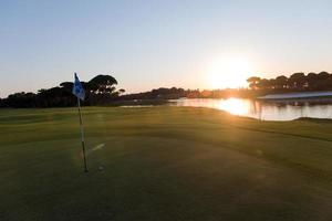 golf ball on edge of  the hole photo