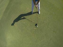 top view of golf player hitting shot photo