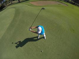 top view of golf player hitting shot photo