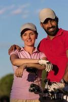 portrait of couple on golf course photo