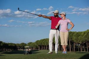 portrait of couple on golf course photo