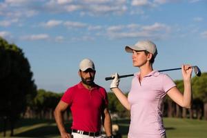 portrait of couple on golf course photo