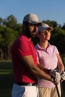 portrait of couple on golf course photo