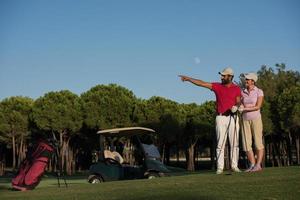 portrait of couple on golf course photo