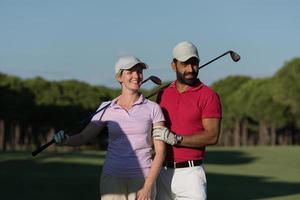 portrait of couple on golf course photo