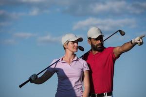 portrait of couple on golf course photo