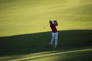 golf player hitting long shot photo