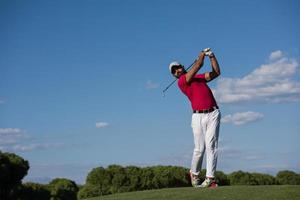 golf player hitting long shot photo