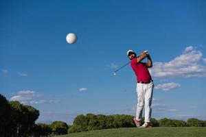 golf player hitting long shot photo