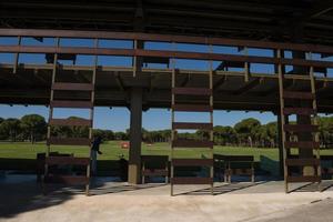 golf player practicing shot on training photo