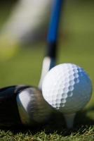 golf club and ball in grass photo