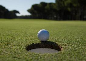 golf ball in the hole photo