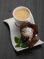 Coffee with muffin on wooden background photo