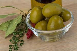 Marinated green olives photo