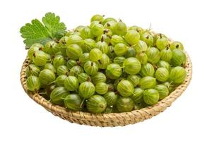 Gooseberry in a basket on white background photo