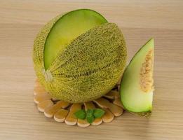 Melon on wooden background photo