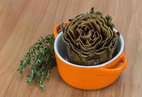 Boiled artichokes in a bowl photo