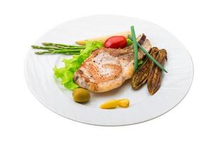 T-bone steak on the plate and white background photo