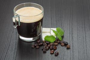 Espresso on wooden background photo