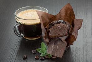 Coffee with muffin on wooden background photo