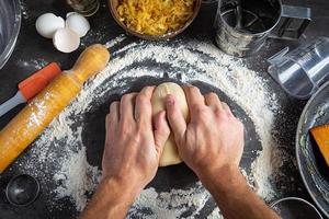 Homemade making dough of pizza, pierogi. Preparation dough for cooking photo