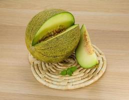 Melon on wooden background photo