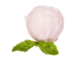 Scoop of strawberry ice cream from top on white background with mint leaf photo