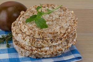 Stack of crispbread on tartan napkin photo