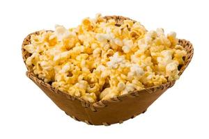 Popcorn in a basket on white background photo