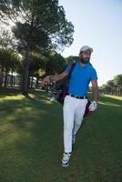 golf player walking photo