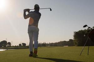 golf player hitting long shot photo