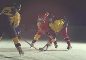 teen ice hockey sport  players in action photo