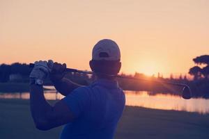 golfer hitting long shot photo