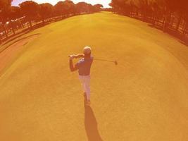 top view of golf player hitting shot photo