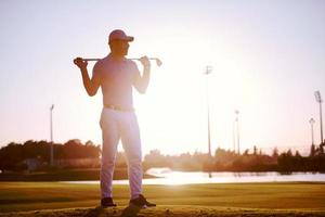 golfer  portrait at golf course on sunset photo