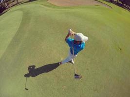 top view of golf player hitting shot photo