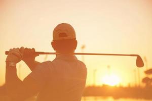 golfer hitting long shot photo