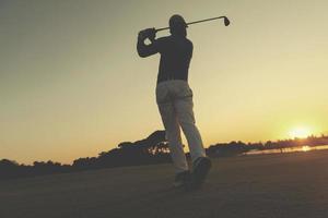 golfer hitting long shot photo