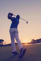 golfer hitting long shot photo