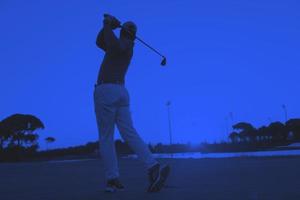 golfer hitting long shot photo