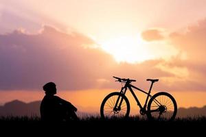 Silhouettes of bikes and cyclists travel concept and exercise by bicycle photo