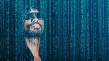 The concept of hackers and insecurity in networking. Dishonest hood man or data thieves photo